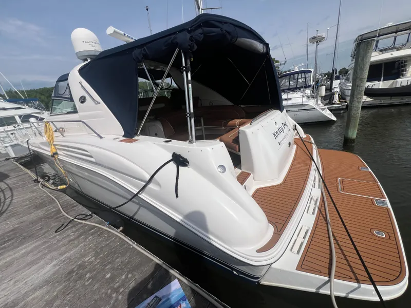 Slide: The Image of 1997 Sea Ray 450 yacht docked with teak deck. - 6