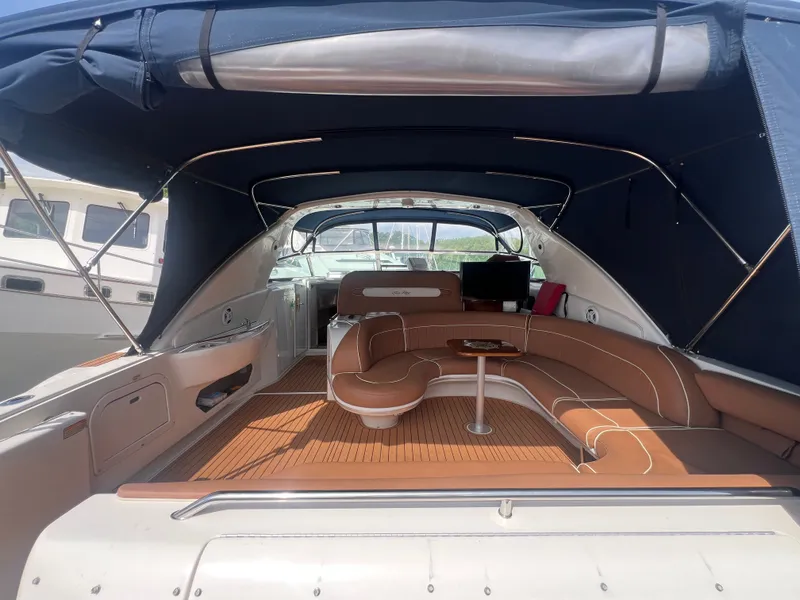 Slide: The Image of Interior of a 1997 Sea Ray 450 yacht with brown seating. - 9