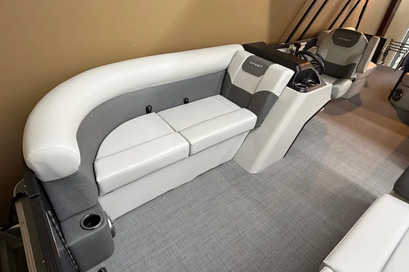 Slide: The Image of 2026 Crest Conquest SE 220 Cruise interior with plush seating and modern design. - 3