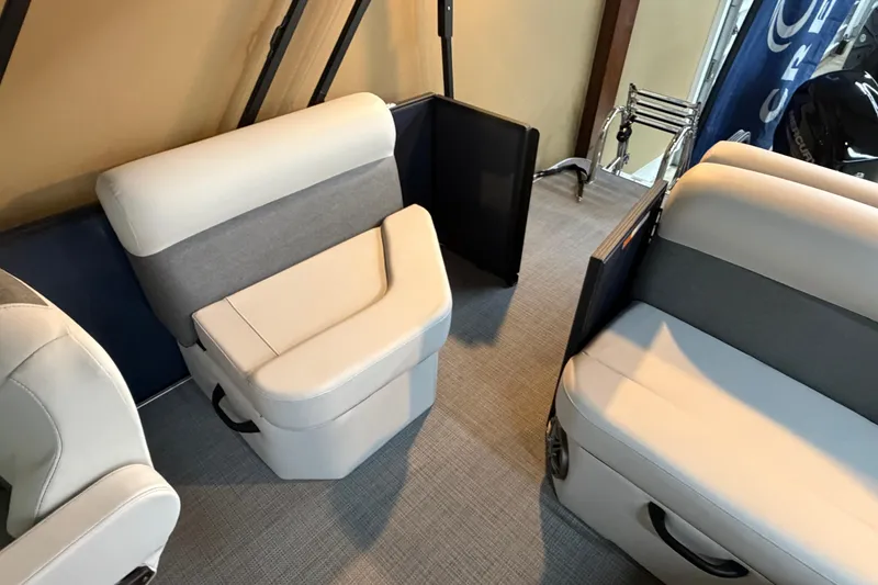 Slide: The Image of 2026 Crest Conquest SE 220 Cruise boat interior with plush seating and modern design. - 8
