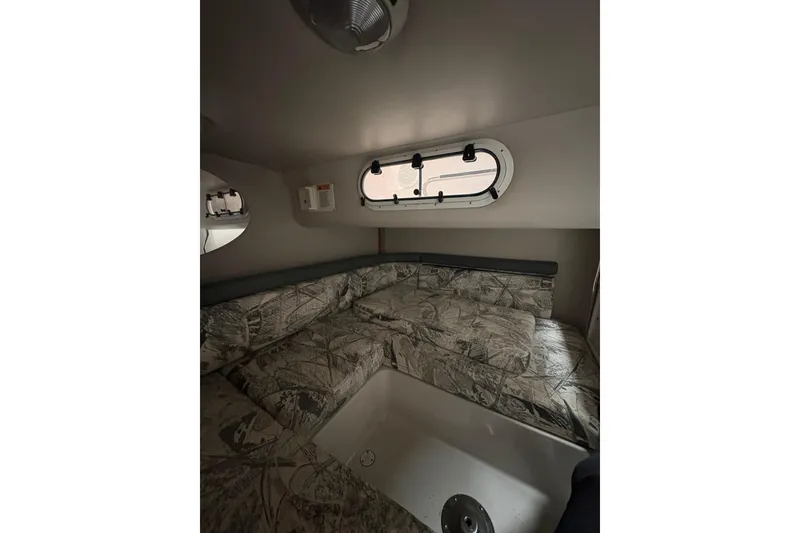 Slide: The Image of Interior cabin of 1999 Four Winns 328 Vista boat with patterned seating. - 36