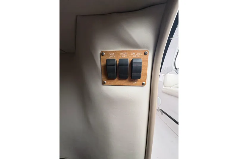 Slide: The Image of 1999 Four Winns 328 Vista light switches for cabin, cockpit, and low-level lighting. - 38