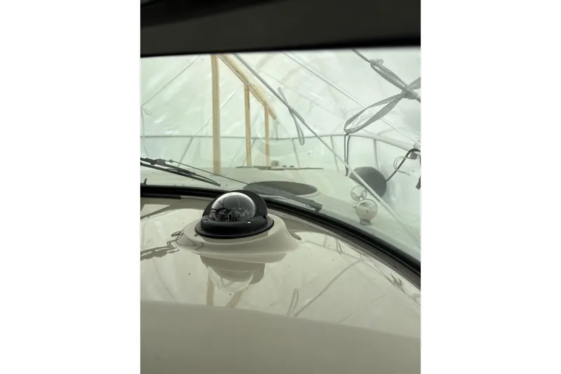 Slide: The Image of 1999 Four Winns 328 Vista boat interior with compass and windshield view. - 43