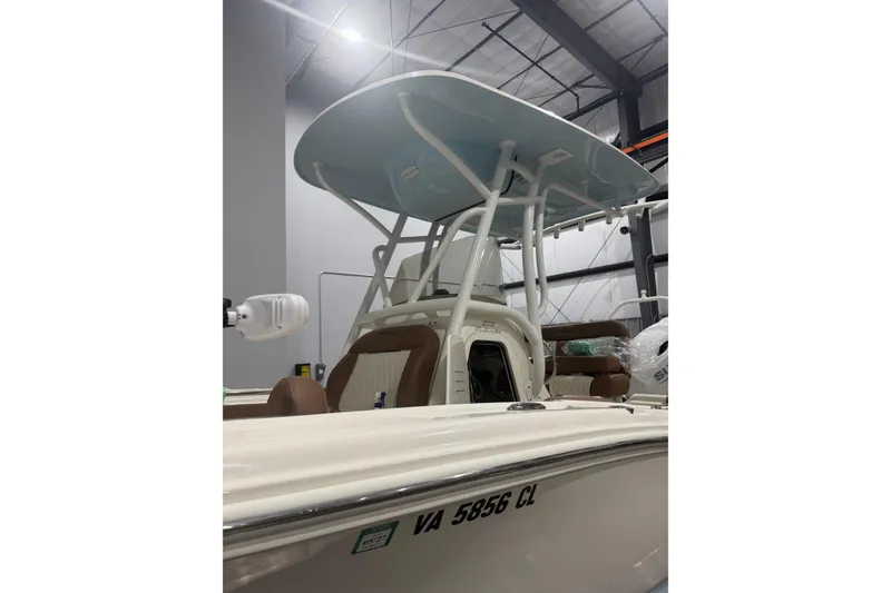 Slide: The Image of 2023 Pioneer 202 Islander boat with T-top in indoor showroom. - 3