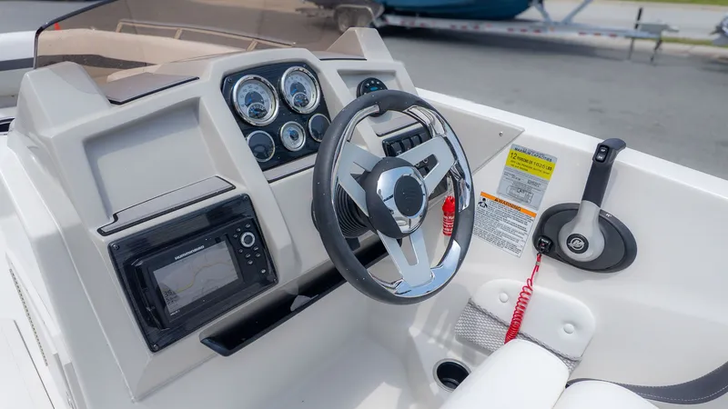 Slide: The Image of Dashboard of 2023 Starcraft 191SVX boat with steering wheel and instruments. - 21