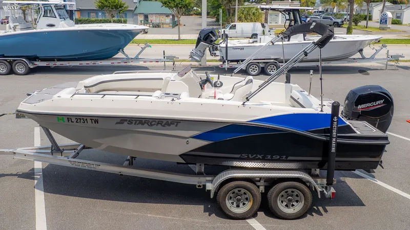 Slide: The Image of 2023 Starcraft 191SVX boat parked on trailer outdoors. - 3