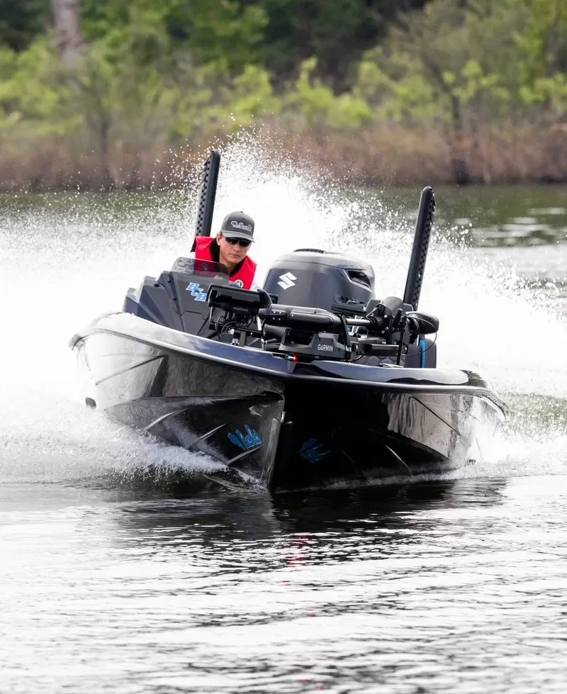 The Image of 2026 Bass Cat Cougar FTD boat speeding on a lake. - 1