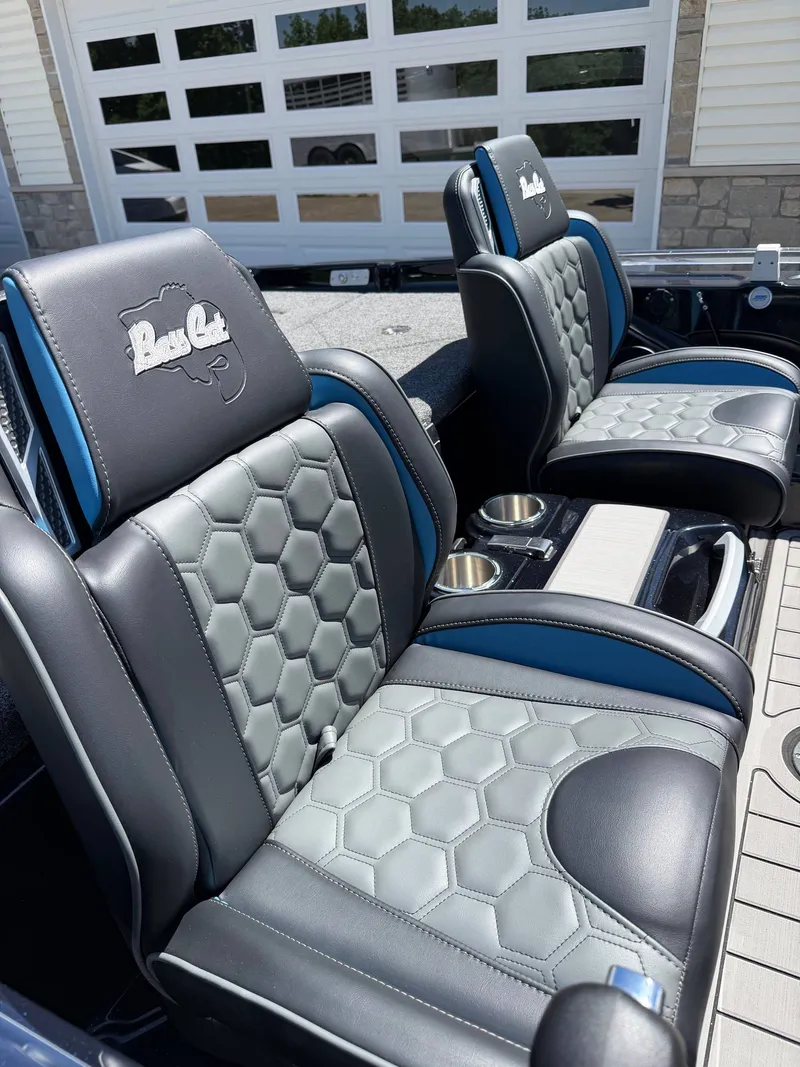 Slide: The Image of 2026 Bass Cat Cougar FTD seats with hexagonal pattern and blue accents. - 10