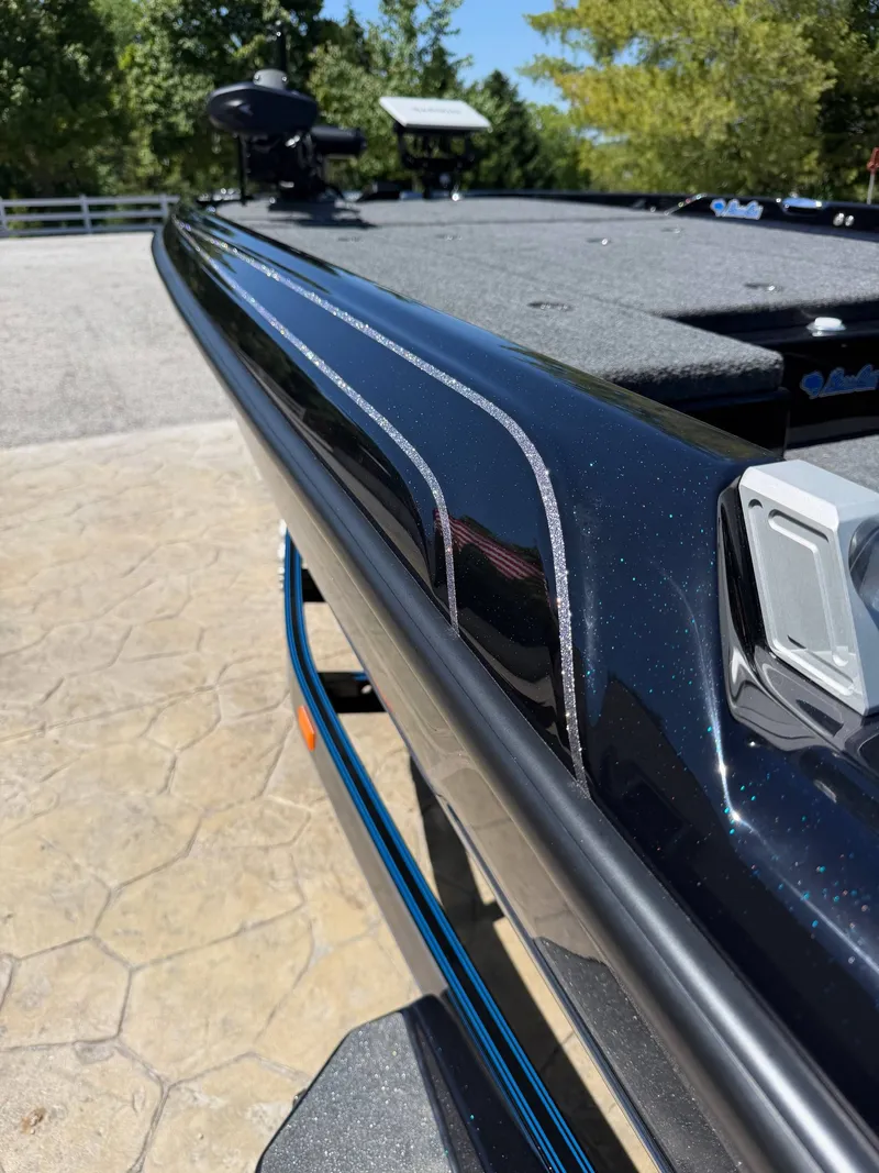 Slide: The Image of 2026 Bass Cat Cougar FTD boat, close-up of deck and design. - 7