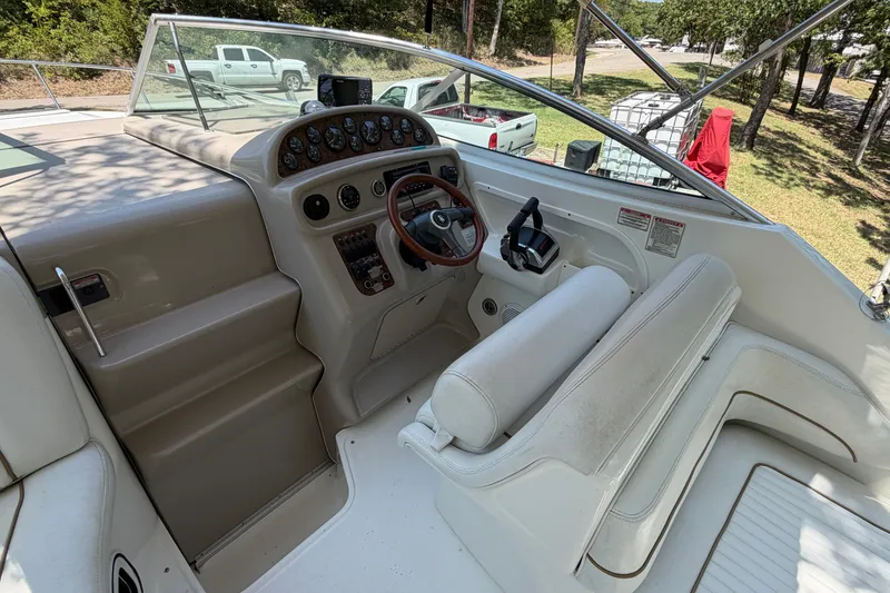 Slide: The Image of Cockpit of 2000 Sea Ray 270 Sundancer with steering wheel and control panel. - 20