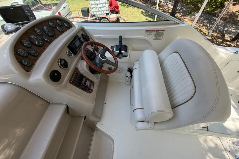 Slide: The Image of Cockpit of 2000 Sea Ray 270 Sundancer with steering wheel and instrument panel. - 25