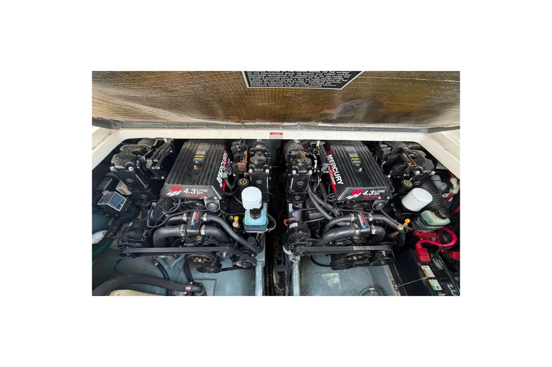 Slide: The Image of Engine compartment of a 2000 Sea Ray 270 Sundancer boat with twin Mercury engines. - 18