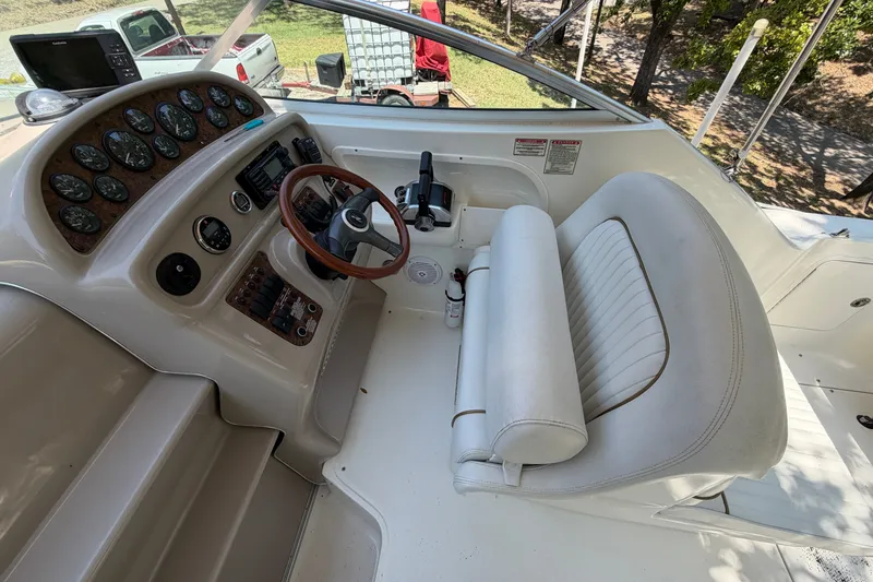 Slide: The Image of Cockpit of 2000 Sea Ray 270 Sundancer with steering wheel and instrument panel. - 21