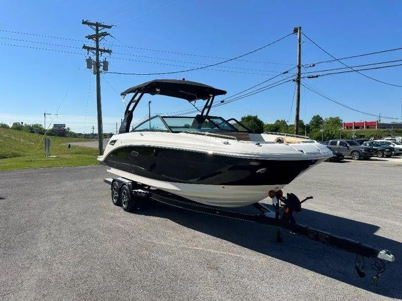 Slide: The Image of 2019 Sea Ray SDX 250 boat parked on trailer outdoors. - 13