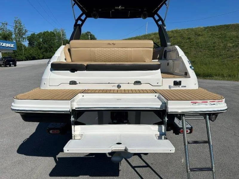 Slide: The Image of Rear view of a 2019 Sea Ray SDX 250 boat with swim platform. - 17