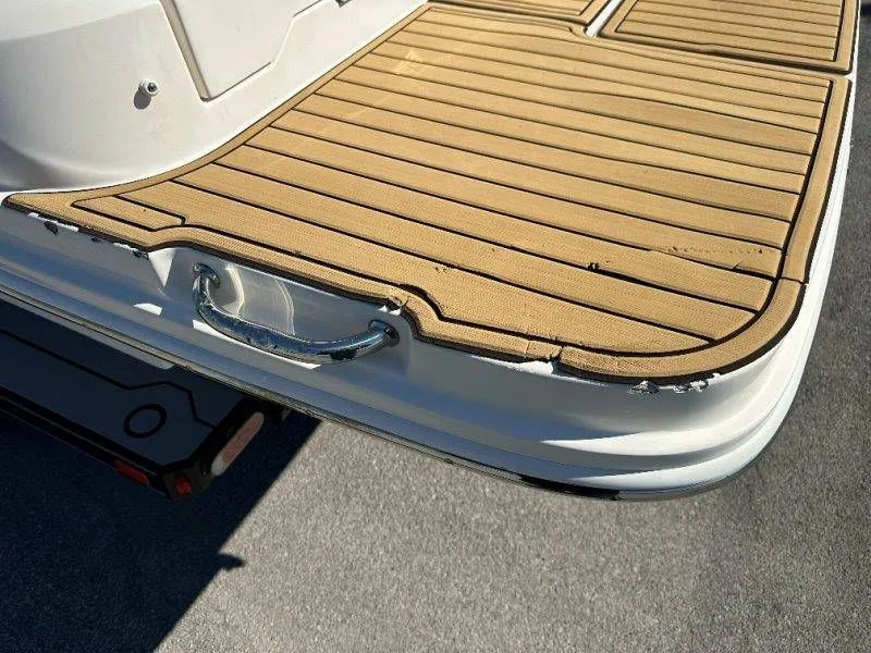 Slide: The Image of Rear view of 2019 Sea Ray SDX 250 with wooden deck. - 18