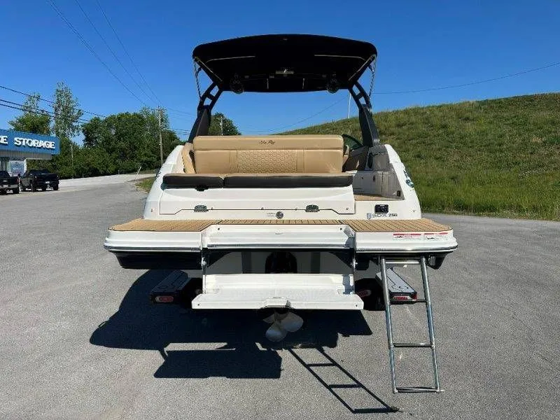Slide: The Image of Rear view of a 2019 Sea Ray SDX 250 boat with swim platform. - 19