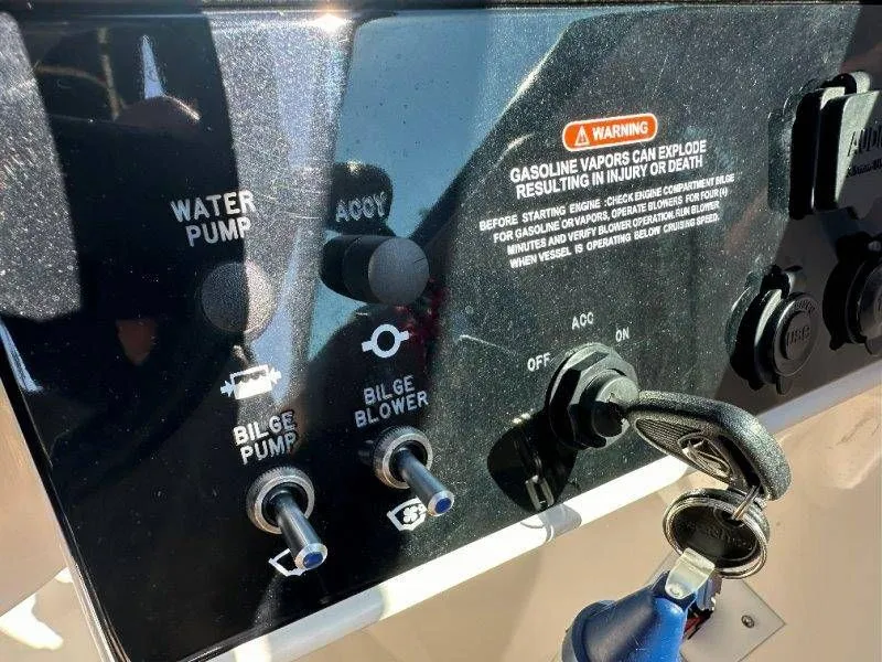 Slide: The Image of 2019 Sea Ray SDX 250 control panel with safety warning. - 20