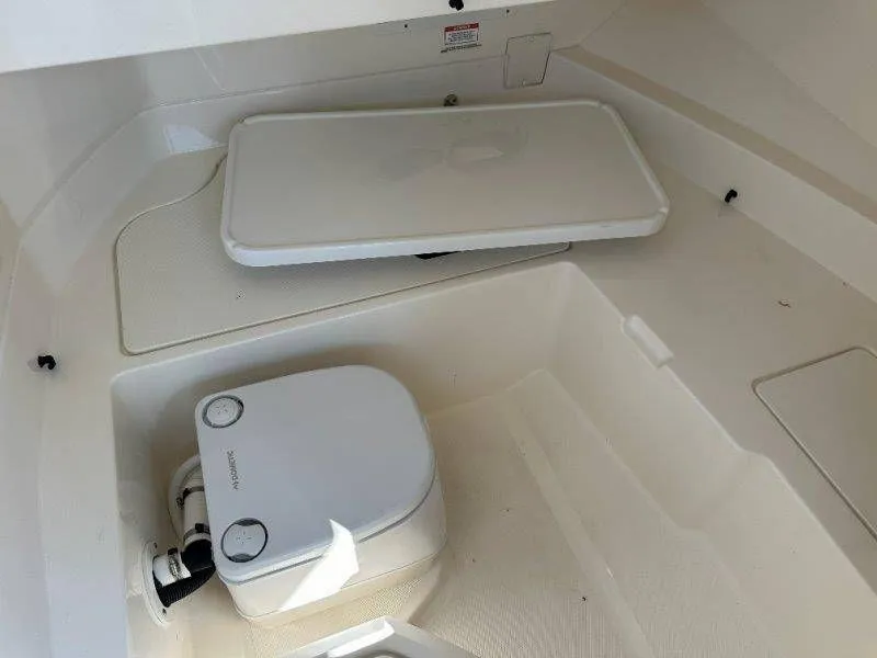 Slide: The Image of Interior of a 2019 Sea Ray SDX 250 with portable toilet. - 21