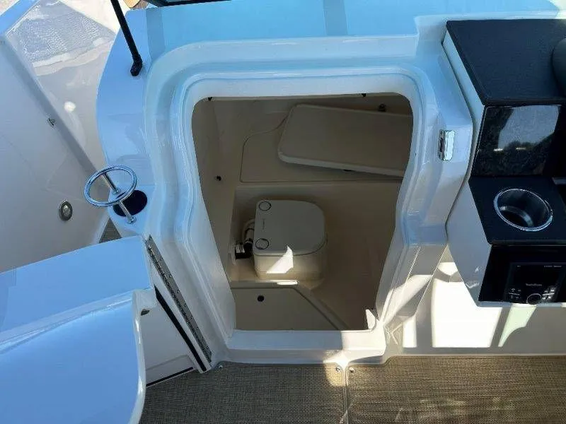 Slide: The Image of Interior of 2019 Sea Ray SDX 250 featuring a toilet. - 22