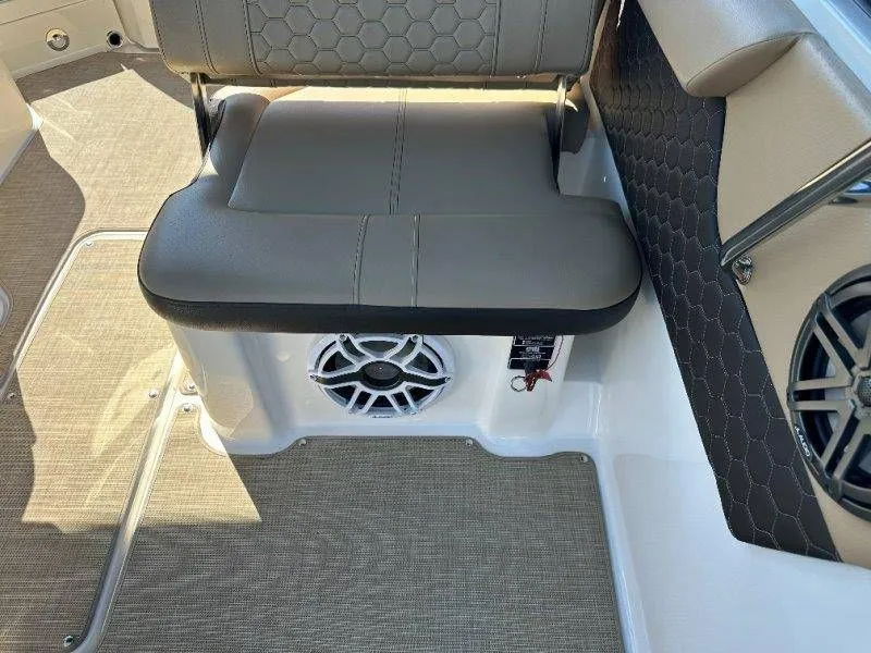 Slide: The Image of Interior of a 2019 Sea Ray SDX 250 boat with seat and speaker. - 24
