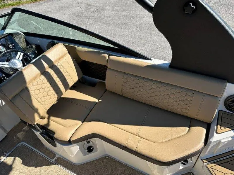 Slide: The Image of Interior of a 2019 Sea Ray SDX 250 with beige upholstery. - 25