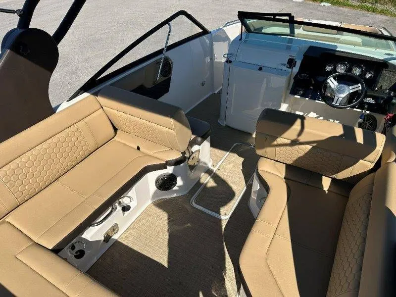 Slide: The Image of Interior of a 2019 Sea Ray SDX 250 with beige seating. - 31