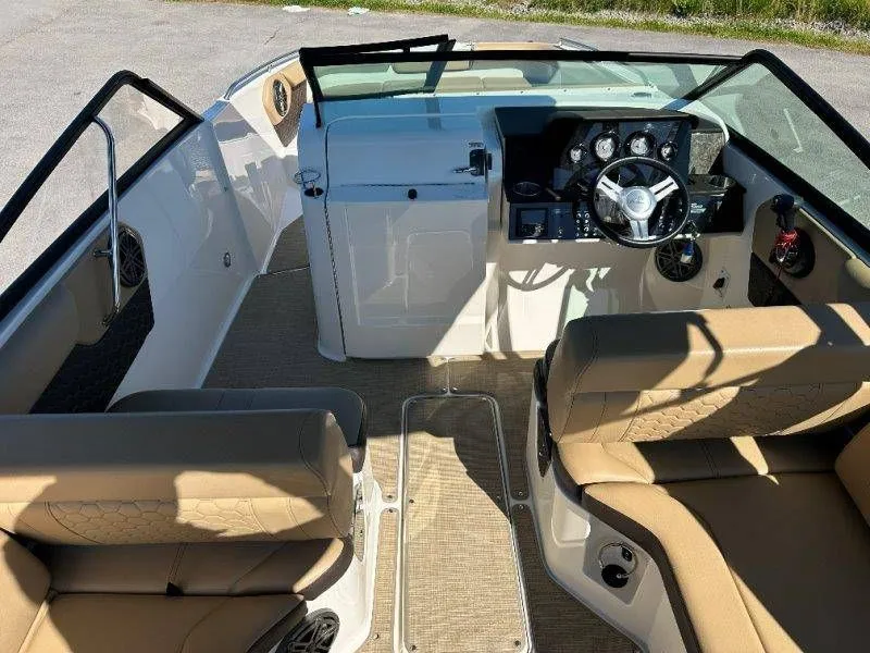 Slide: The Image of Interior of a 2019 Sea Ray SDX 250 boat with beige seating. - 35