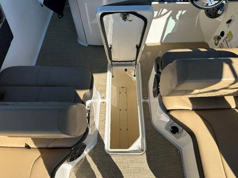 Slide: The Image of Interior of a 2019 Sea Ray SDX 250 with open storage compartment. - 42