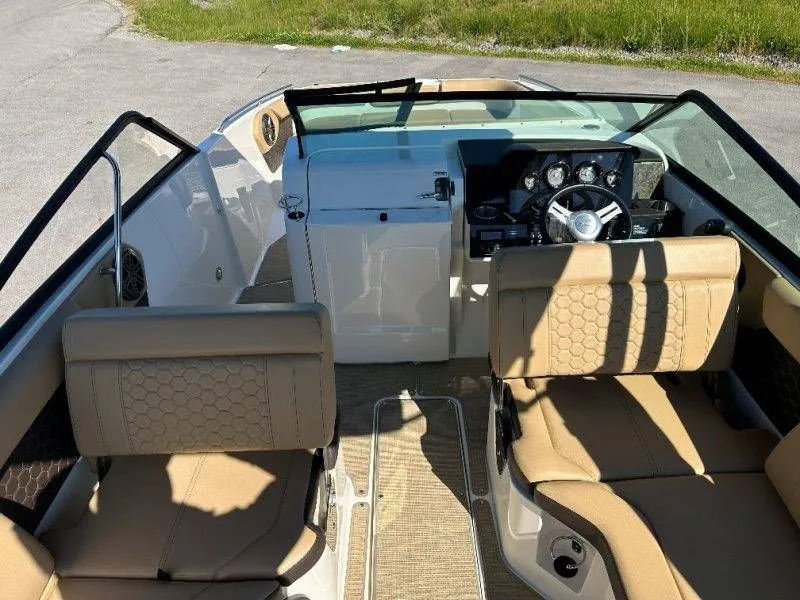 Slide: The Image of Interior of a 2019 Sea Ray SDX 250 boat with beige seating. - 43