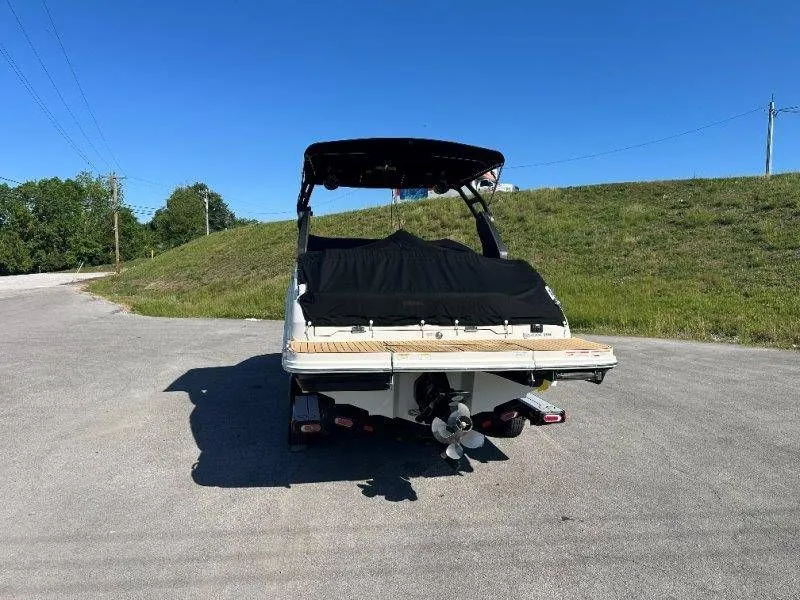 Slide: The Image of Rear view of a 2019 Sea Ray SDX 250 boat on asphalt. - 45
