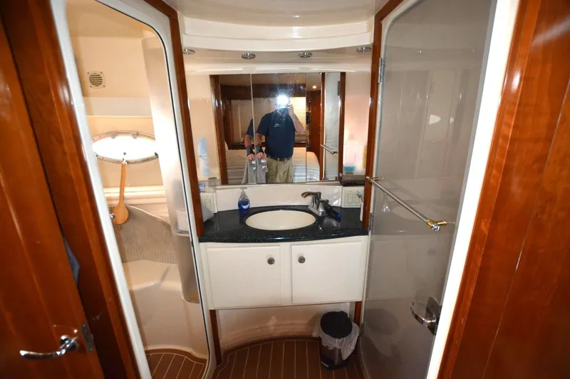 Slide: The Image of Bathroom interior of 2000 Carver 504 Cockpit Motor Yacht with sink and mirror. - 18