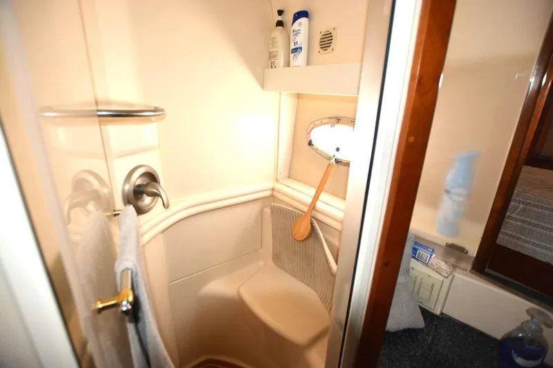 Slide: The Image of Compact bathroom in 2000 Carver 504 Cockpit Motor Yacht with shower and toiletries. - 19