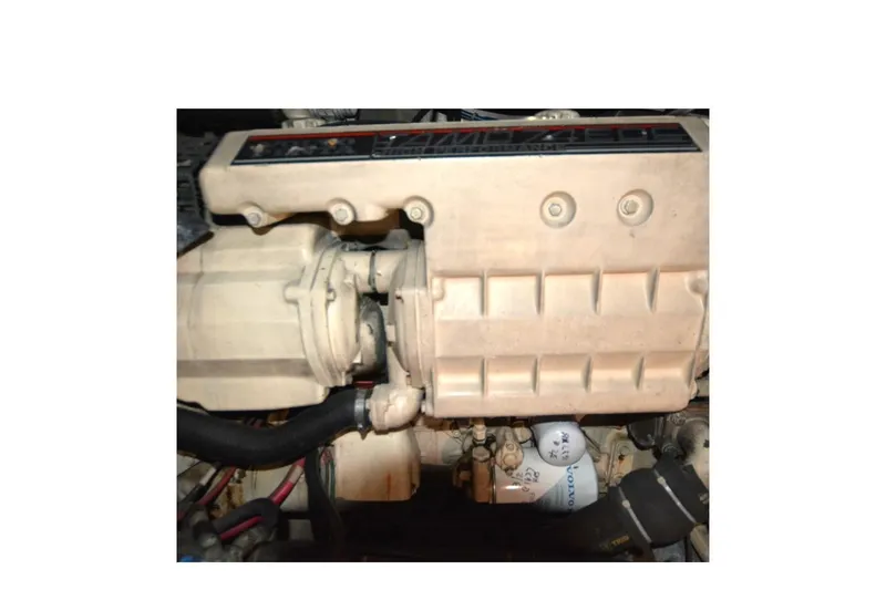 Slide: The Image of Engine compartment of a 2000 Carver 504 Cockpit Motor Yacht, featuring mechanical components. - 23