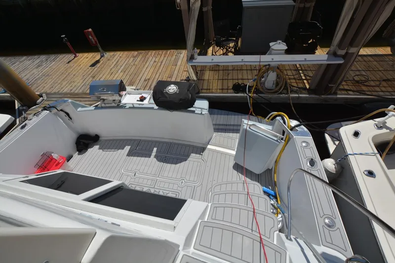 Slide: The Image of 2000 Carver 504 Cockpit Motor Yacht docked, featuring spacious deck and equipment. - 9