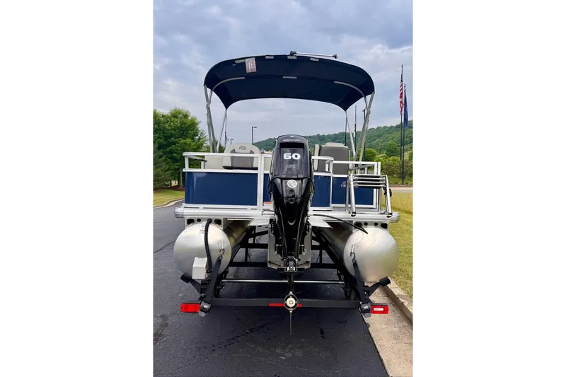 Slide: The Image of 2026 Sun Tracker Bass Buggy 18 DLX pontoon boat with 60 HP Mercury engine. - 5