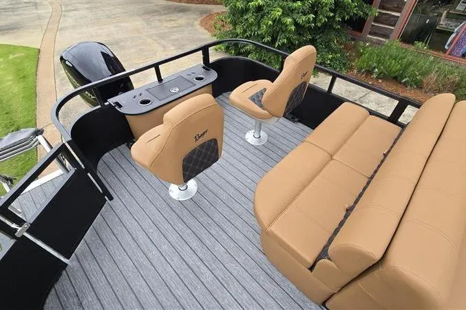 Slide: The Image of 2026 Ranger 223F boat interior with tan seating and sleek design. - 10