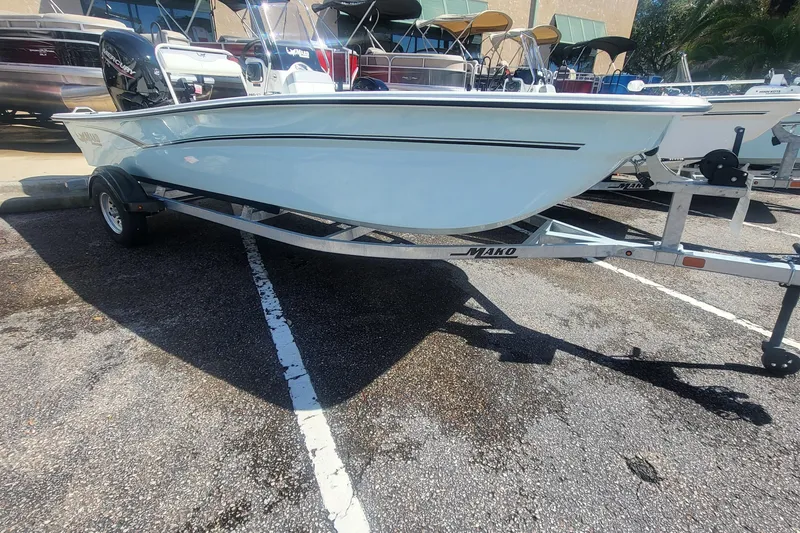 Slide: The Image of 2026 Mako Pro Skiff 17 CC boat on trailer in parking lot. - 47