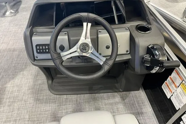 Slide: The Image of Steering console of 2026 Sun Tracker SportFish 20 DLX pontoon boat, featuring modern controls. - 104