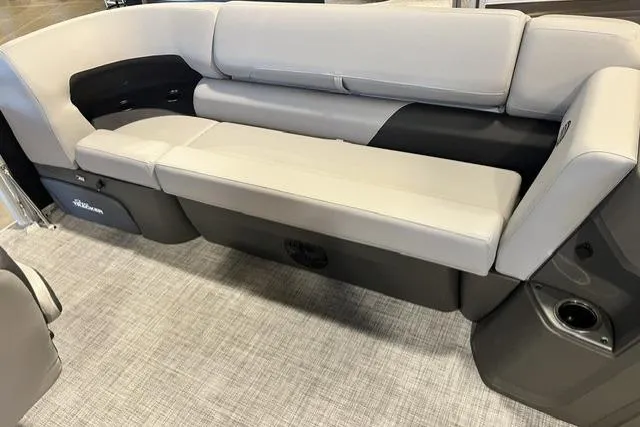Slide: The Image of 2026 Sun Tracker SportFish 20 DLX boat interior with cushioned seating and storage compartments. - 9