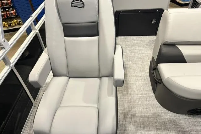 Slide: The Image of 2026 Sun Tracker SportFish 20 DLX boat seats with gray upholstery and armrests. - 101