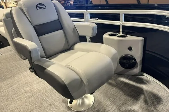 Slide: The Image of Luxurious seating on 2026 Sun Tracker SportFish 20 DLX pontoon boat, featuring cup holders and speaker. - 102