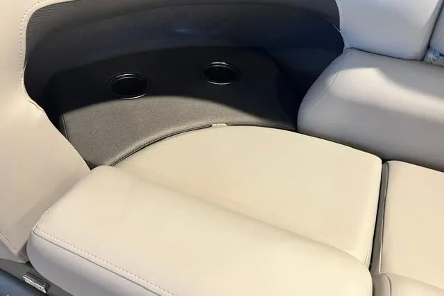 Slide: The Image of 2026 Sun Tracker SportFish 20 DLX boat seating with integrated cup holders. - 10