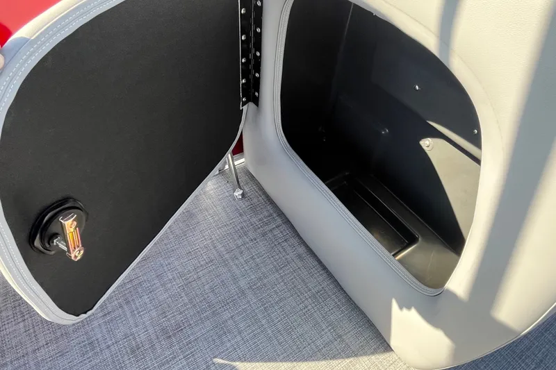 Slide: The Image of Open storage compartment on 2026 Sun Tracker Party Barge 18 DLX pontoon boat. - 23