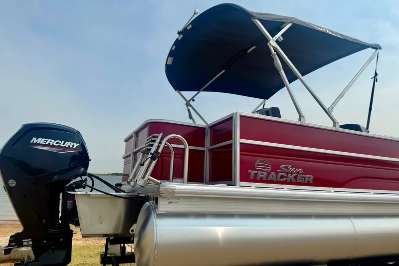 Slide: The Image of 2026 Sun Tracker Party Barge 18 DLX pontoon boat with Mercury engine and canopy. - 25