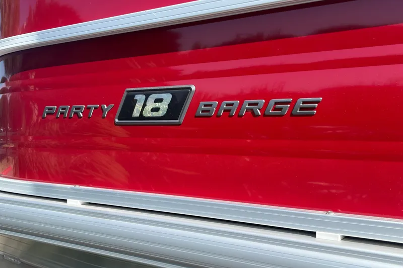 Slide: The Image of 2026 Sun Tracker Party Barge 18 DLX, red exterior detail. - 28