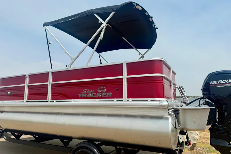 Slide: The Image of 2026 Sun Tracker Party Barge 18 DLX pontoon boat with canopy and Mercury engine. - 24