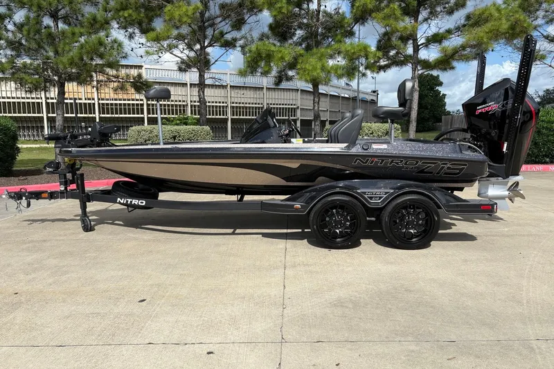 The Image of 2026 Nitro Z19 XL Pro boat on trailer, parked outdoors, showcasing sleek design and modern features. - 0