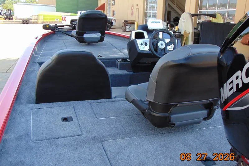 Slide: The Image of 2026 Tracker Pro Team 190 boat interior with steering console and seating. - 64