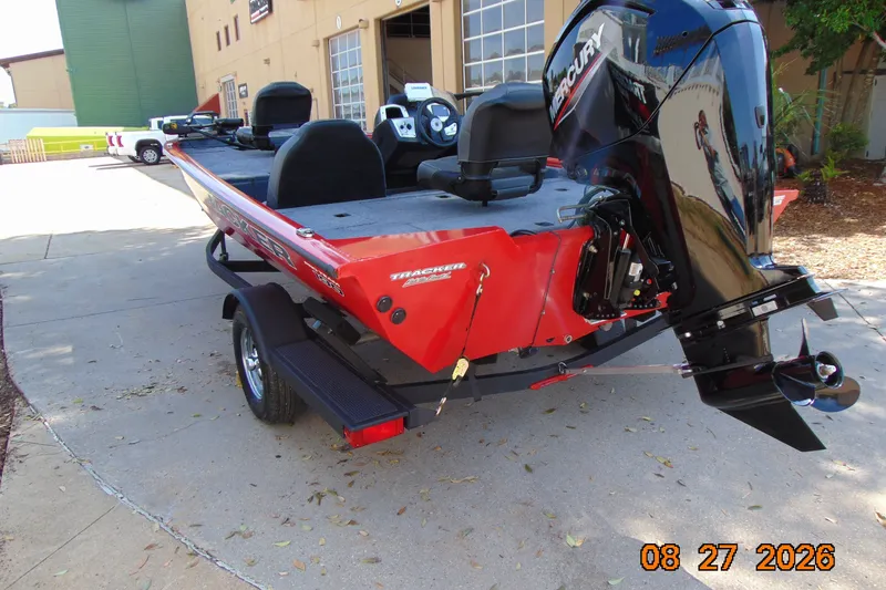 Slide: The Image of 2026 Tracker Pro Team 190 boat with Mercury engine, parked outdoors. - 71